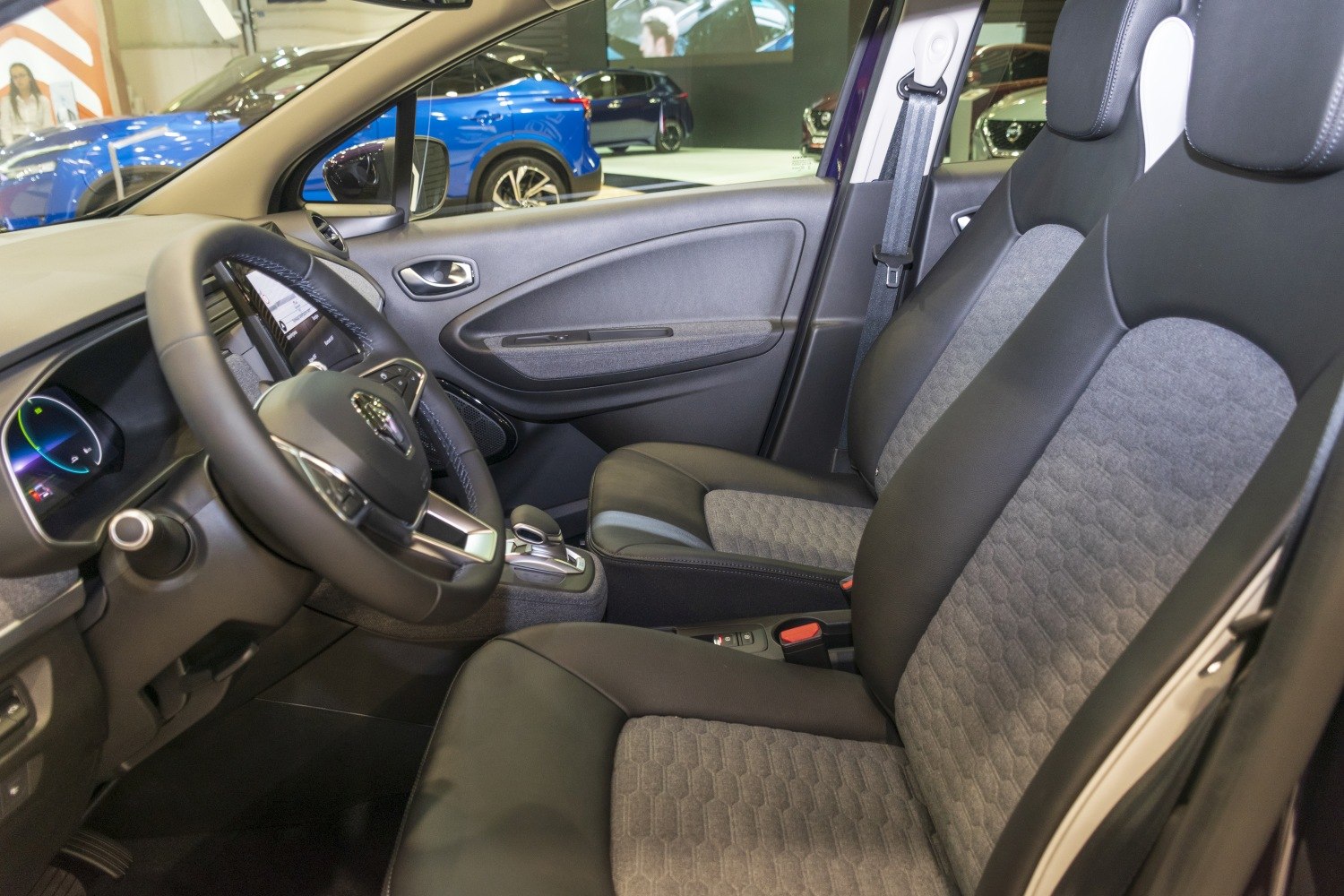 Front seats and dashboard interior with steering wheel and door panel