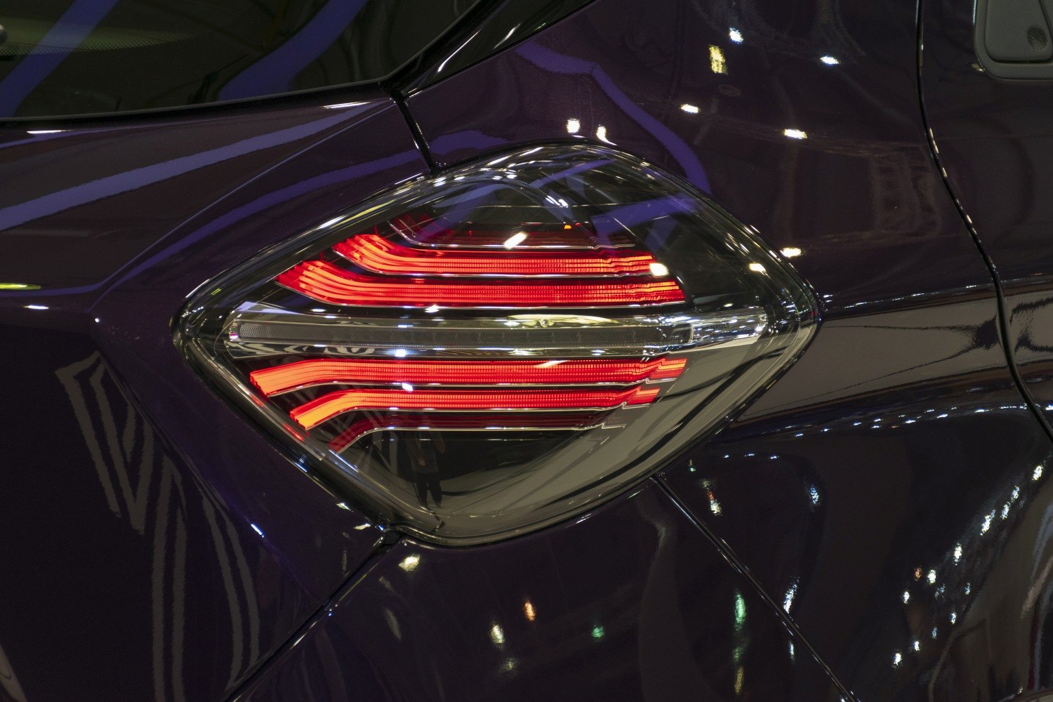Close-up of modern rear tail light with red LED patterns