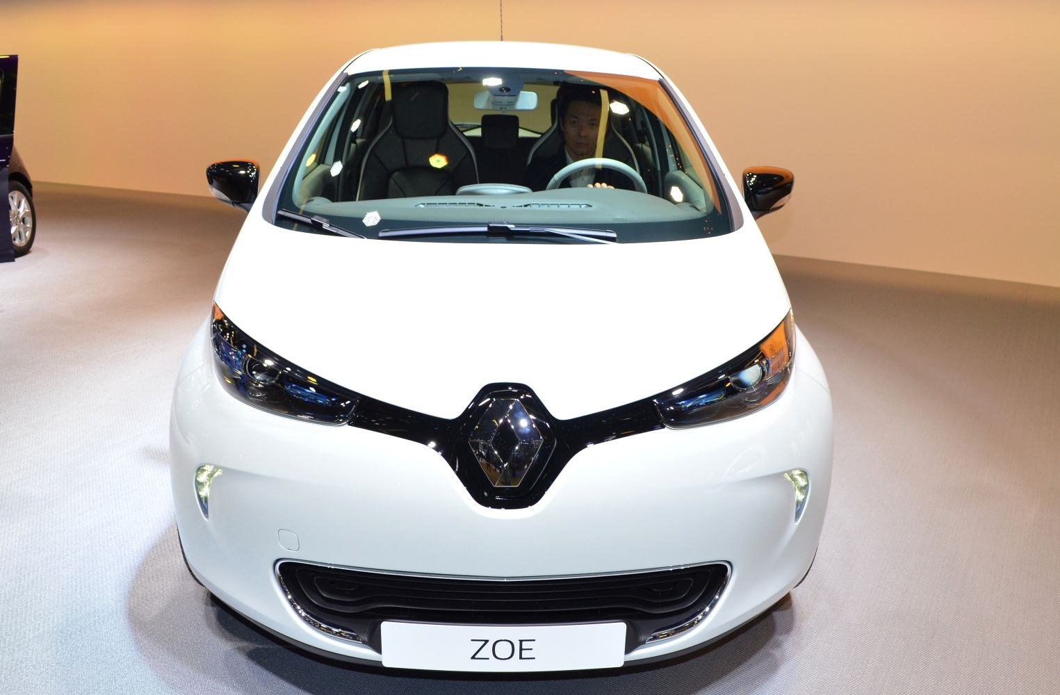 Front view with sleek headlights and unique grille