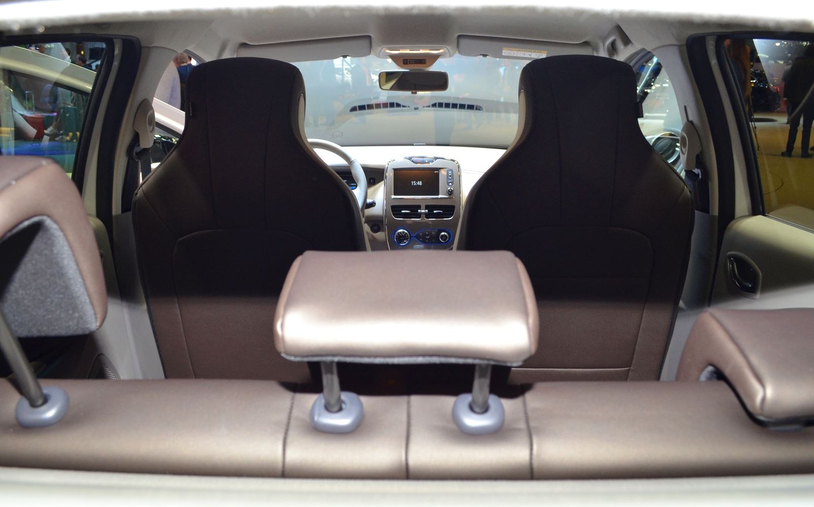 Front seats, dashboard, and rear headrest view of car interior