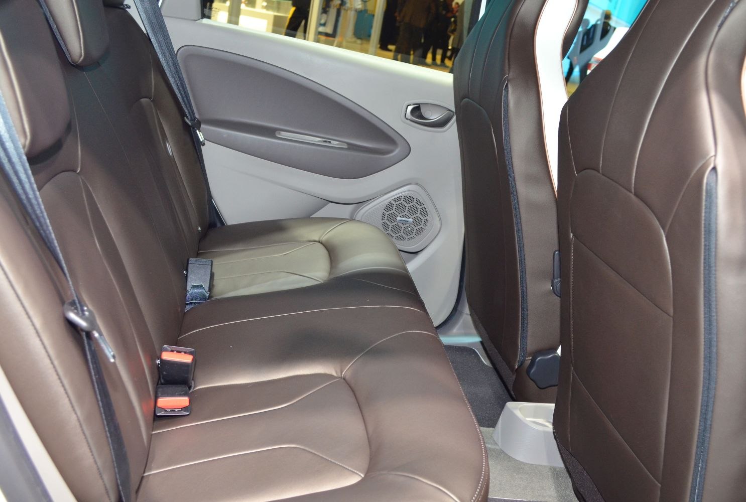 Brown leather rear seats with door panel and seatbelts