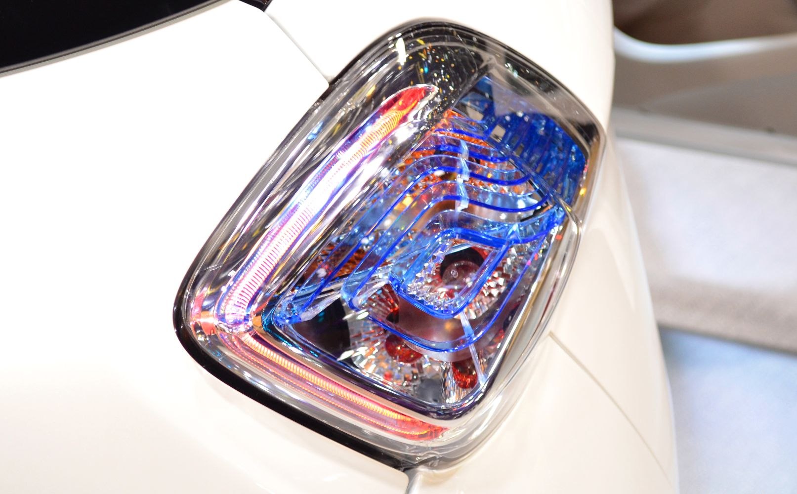 Close-up of unique, colorful tail light with intricate design elements.