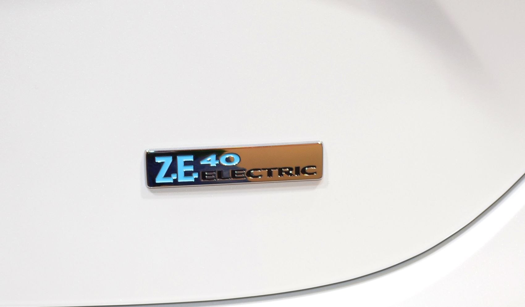 Close-up view of Z.E. 40 electric badge on a white surface