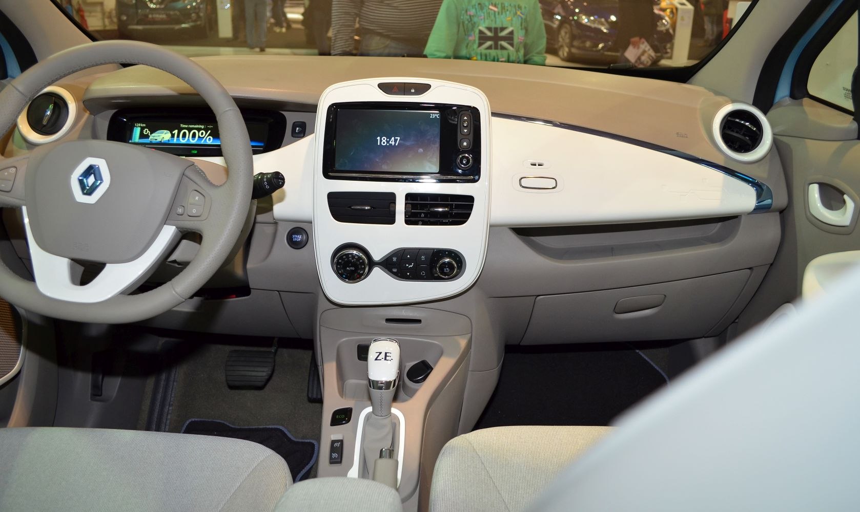 Digital instrument cluster and touchscreen infotainment in beige interior