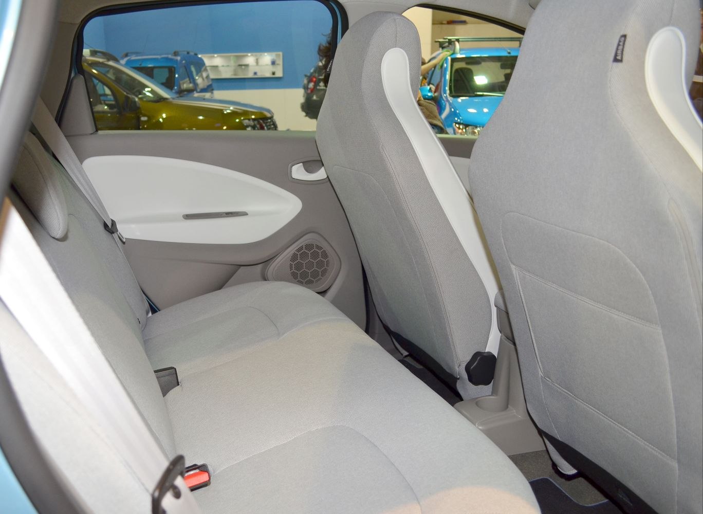 Rear seat interior with gray fabric upholstery and door panel