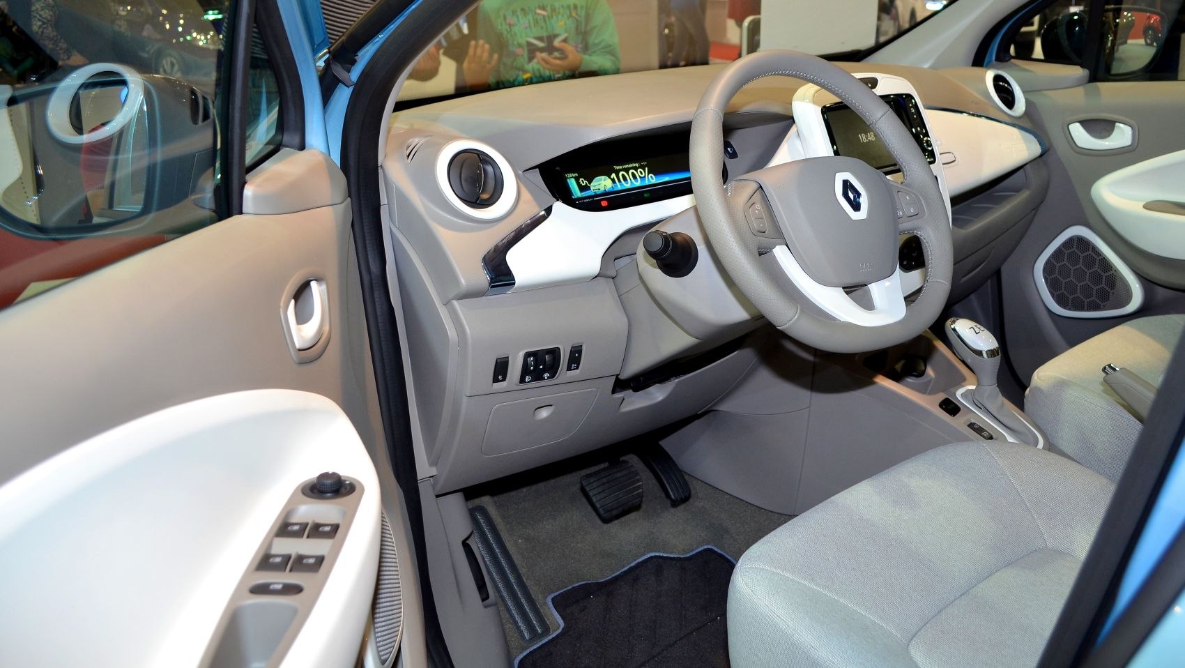 Dashboard, steering wheel, pedals, and control panel of a car interior