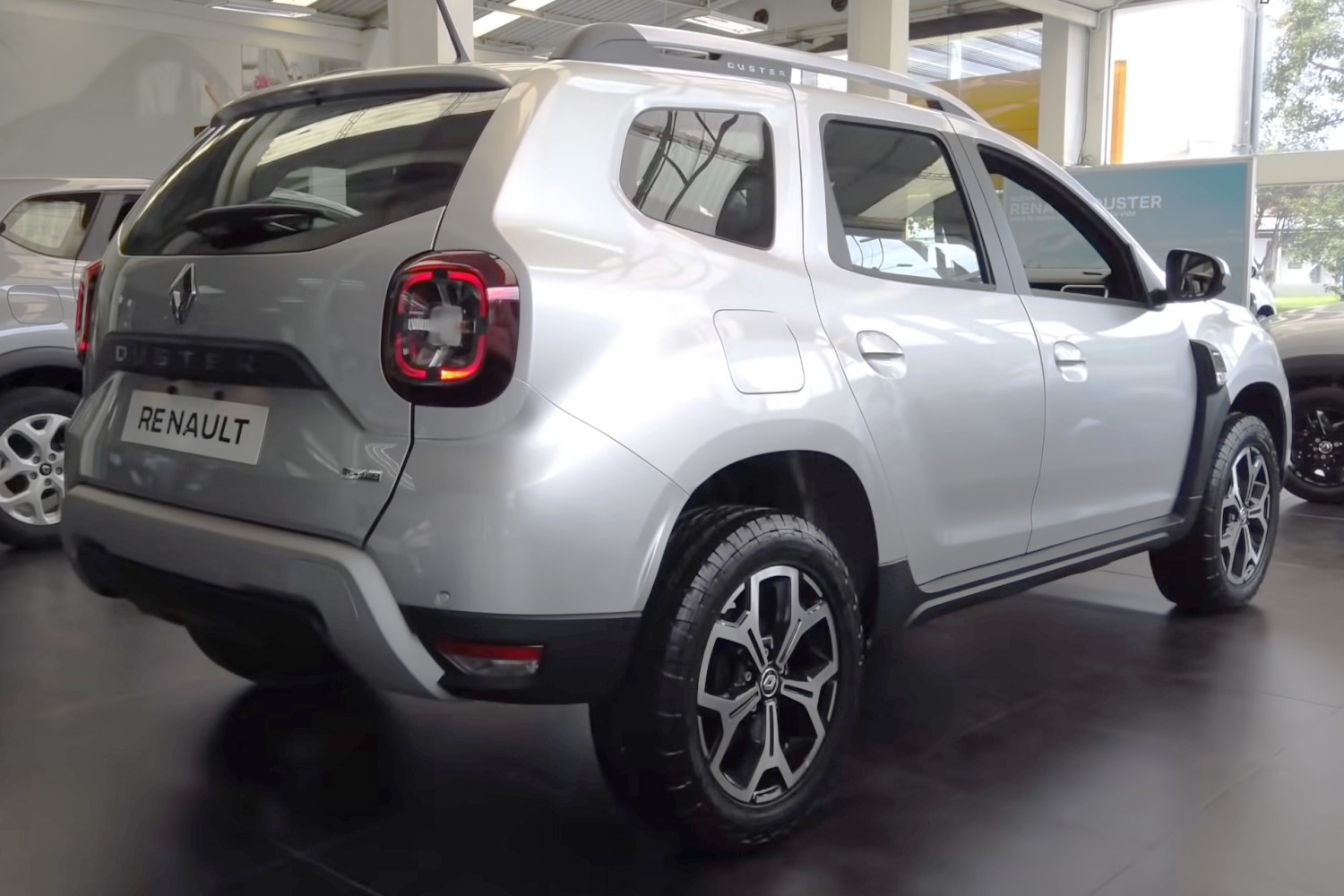 Rear and side view with prominent taillights and alloy wheels