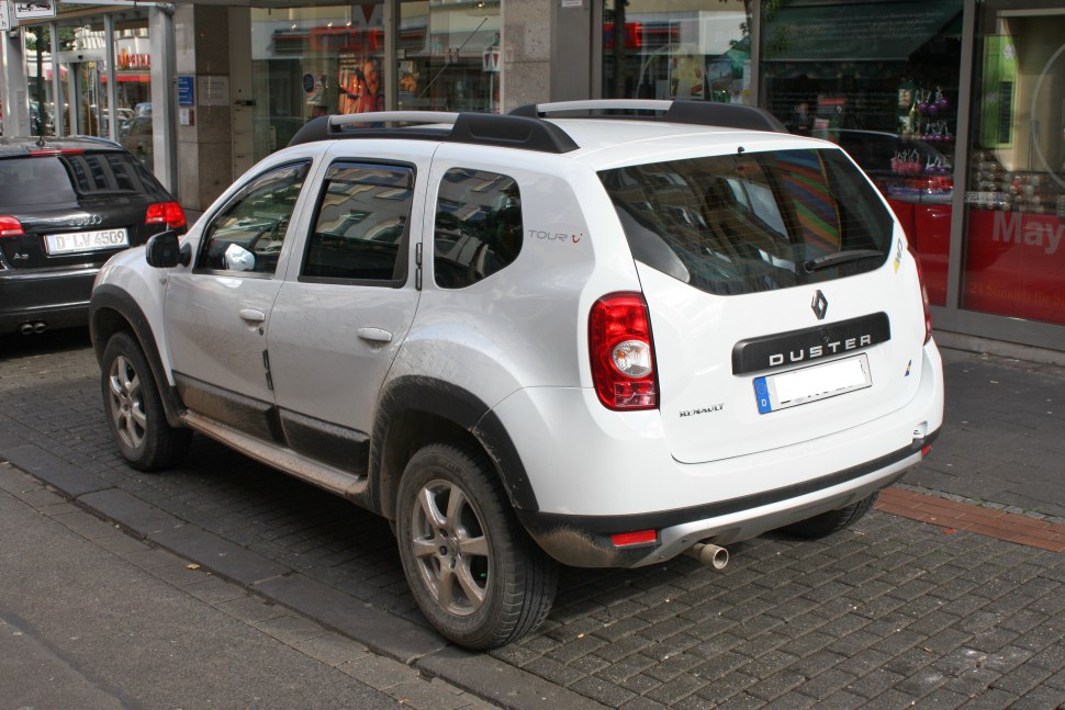 Rear and side view of rugged SUV with roof rails and alloy wheels