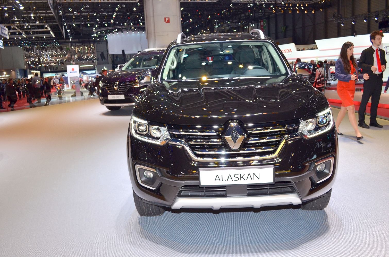 Front view of black pickup truck with prominent grille and headlights