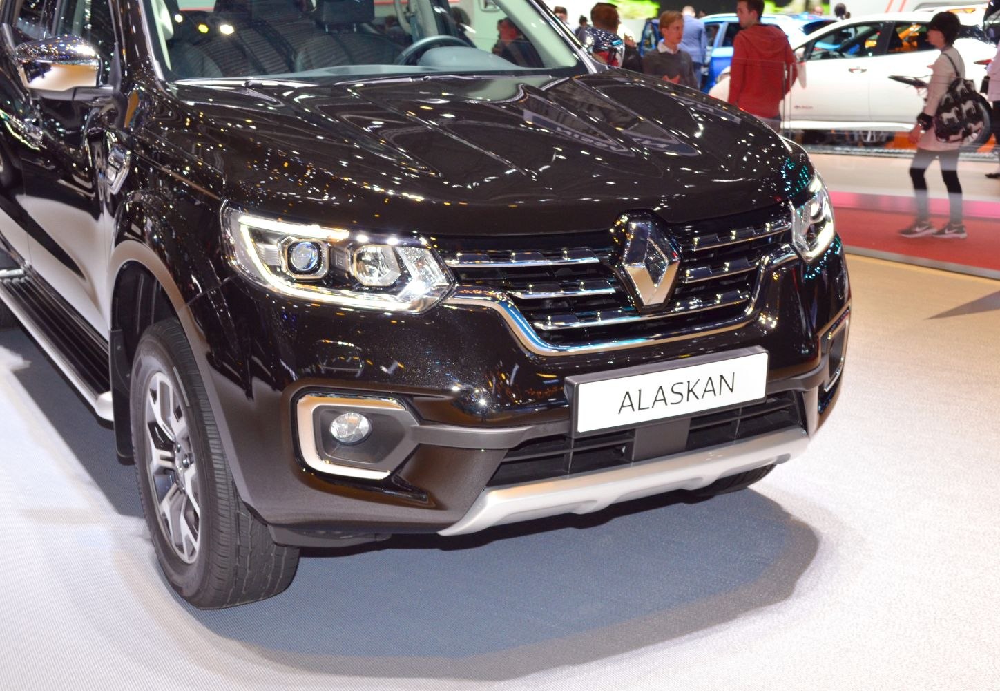 Close-up of LED headlights and chrome grille at truck front