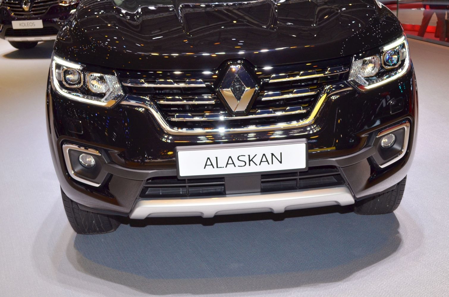 Close-up of front grille with LED headlights and fog lights