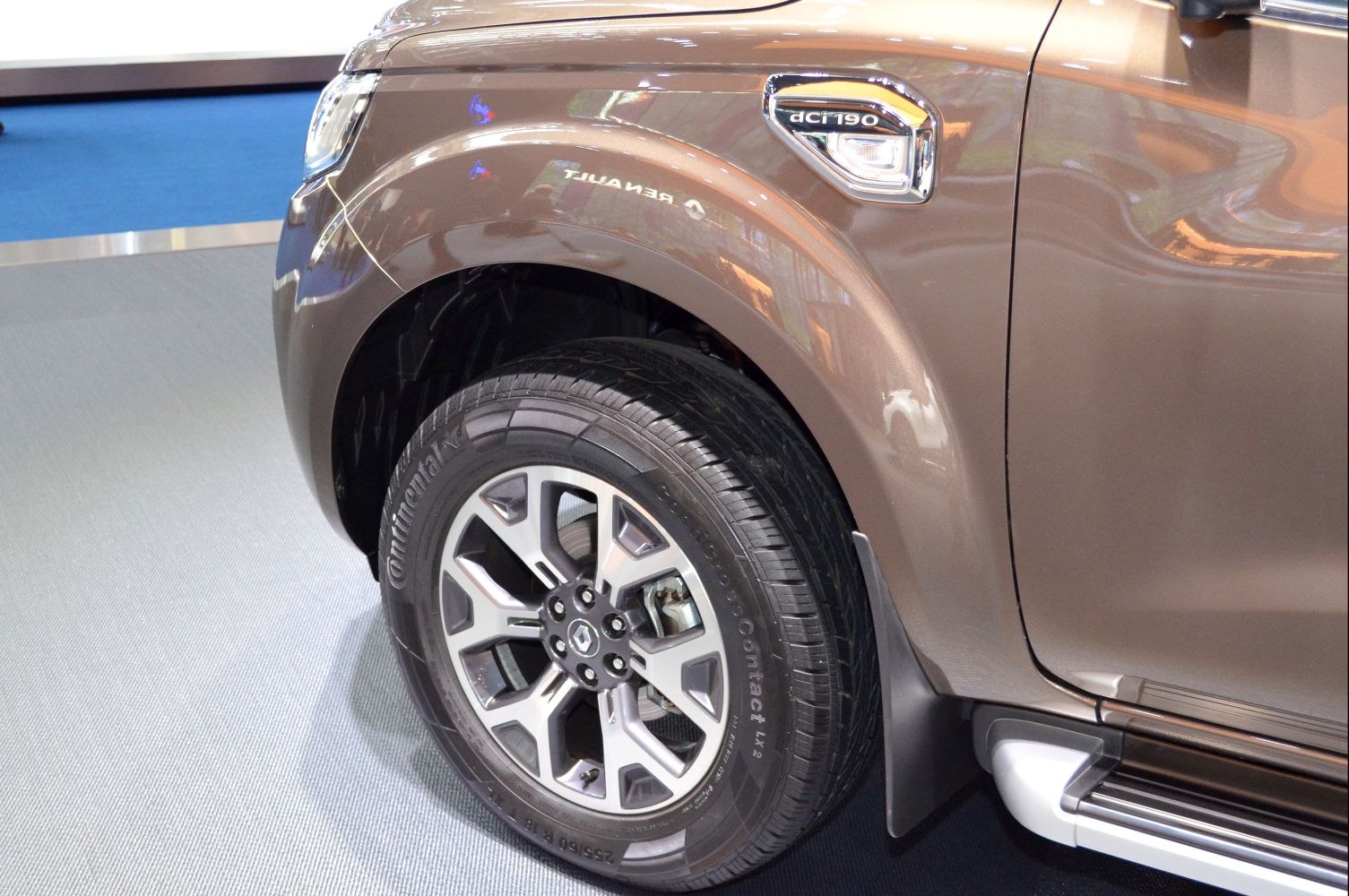 Front wheel and fender with AC 190 badge on pickup