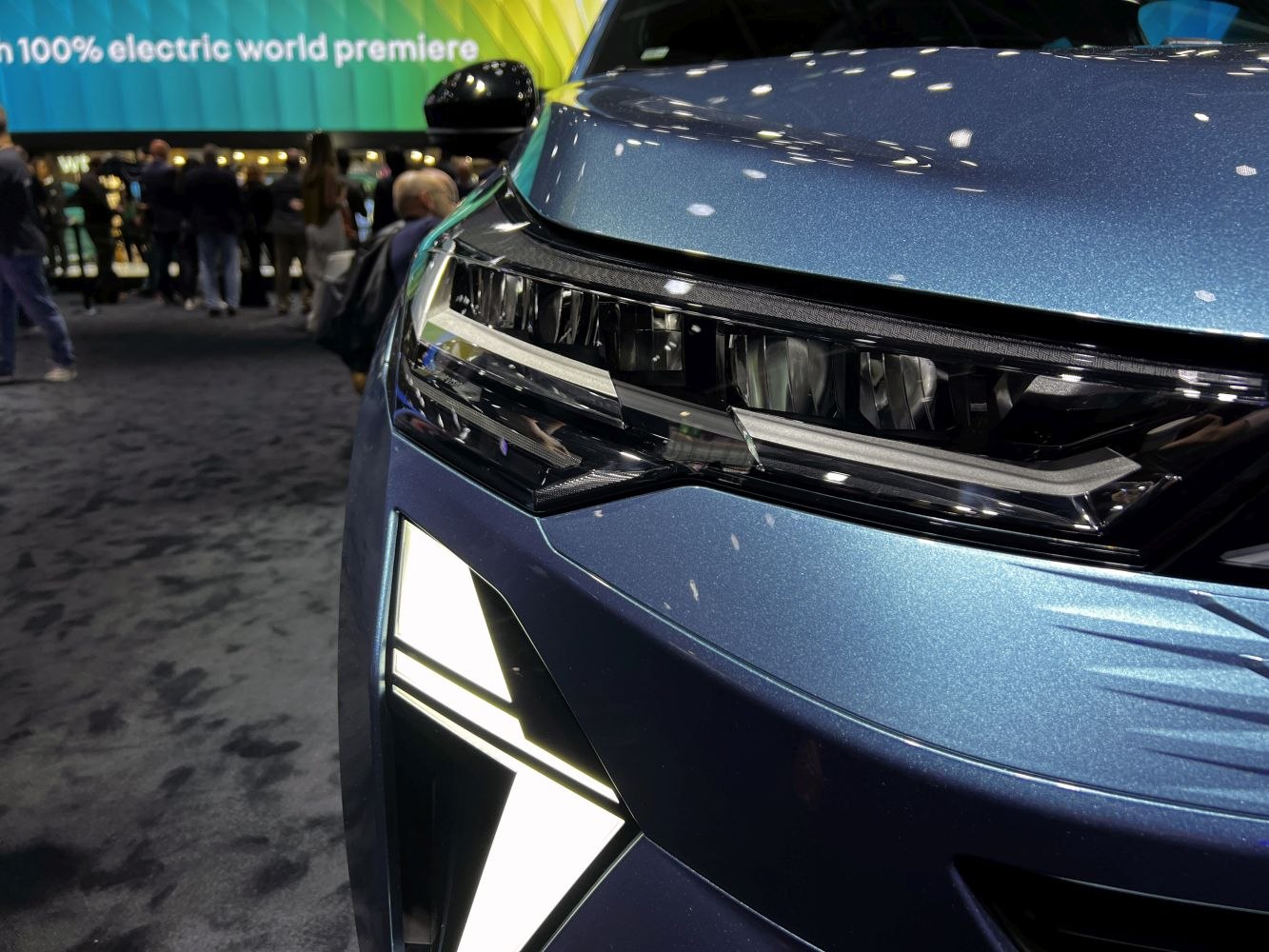 Close-up of Renault Symbioz front headlight and geometric LED daytime running lights