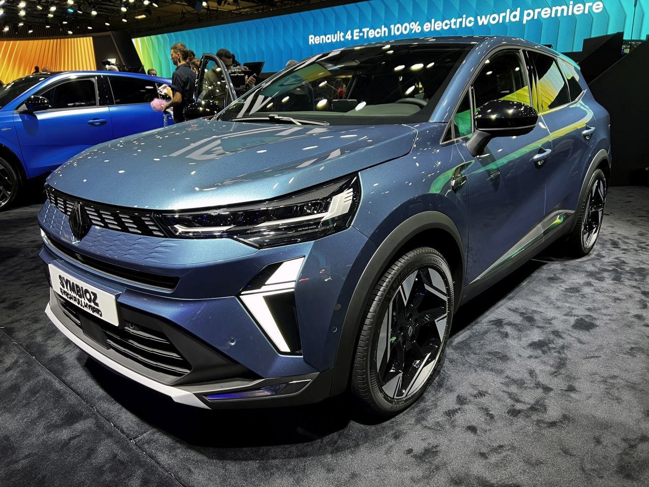 Front and side view of an electric SUV with LED headlights and sleek design