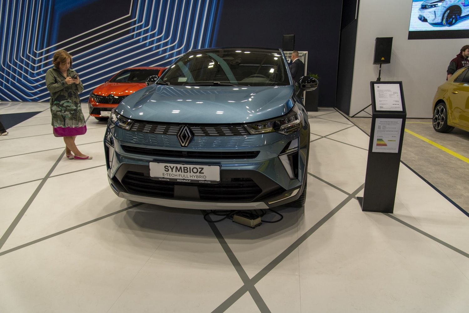 Front view of hybrid SUV with LED headlights and modern grille