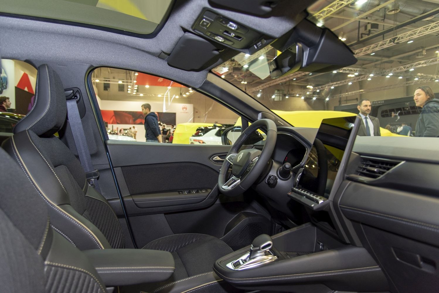 Modern car interior with panoramic roof and digital dashboard