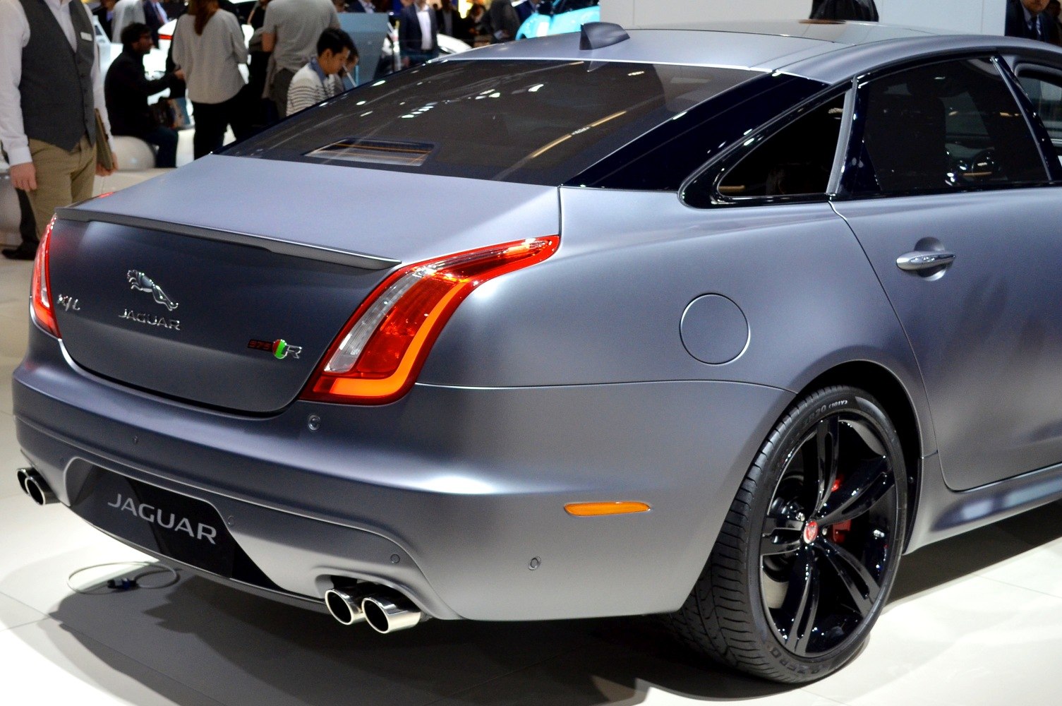 Rear tail light, quad exhausts, and alloy wheel of prestige sedan