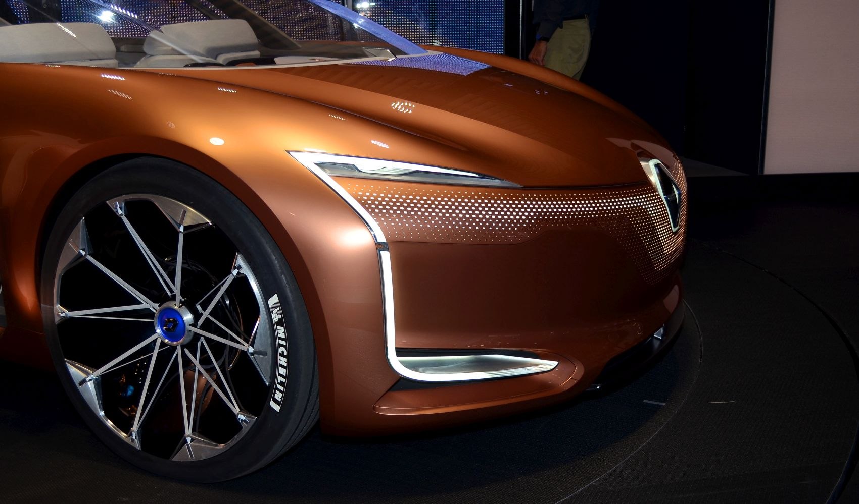 Futuristic car front end with LED headlights and detailed alloy wheel