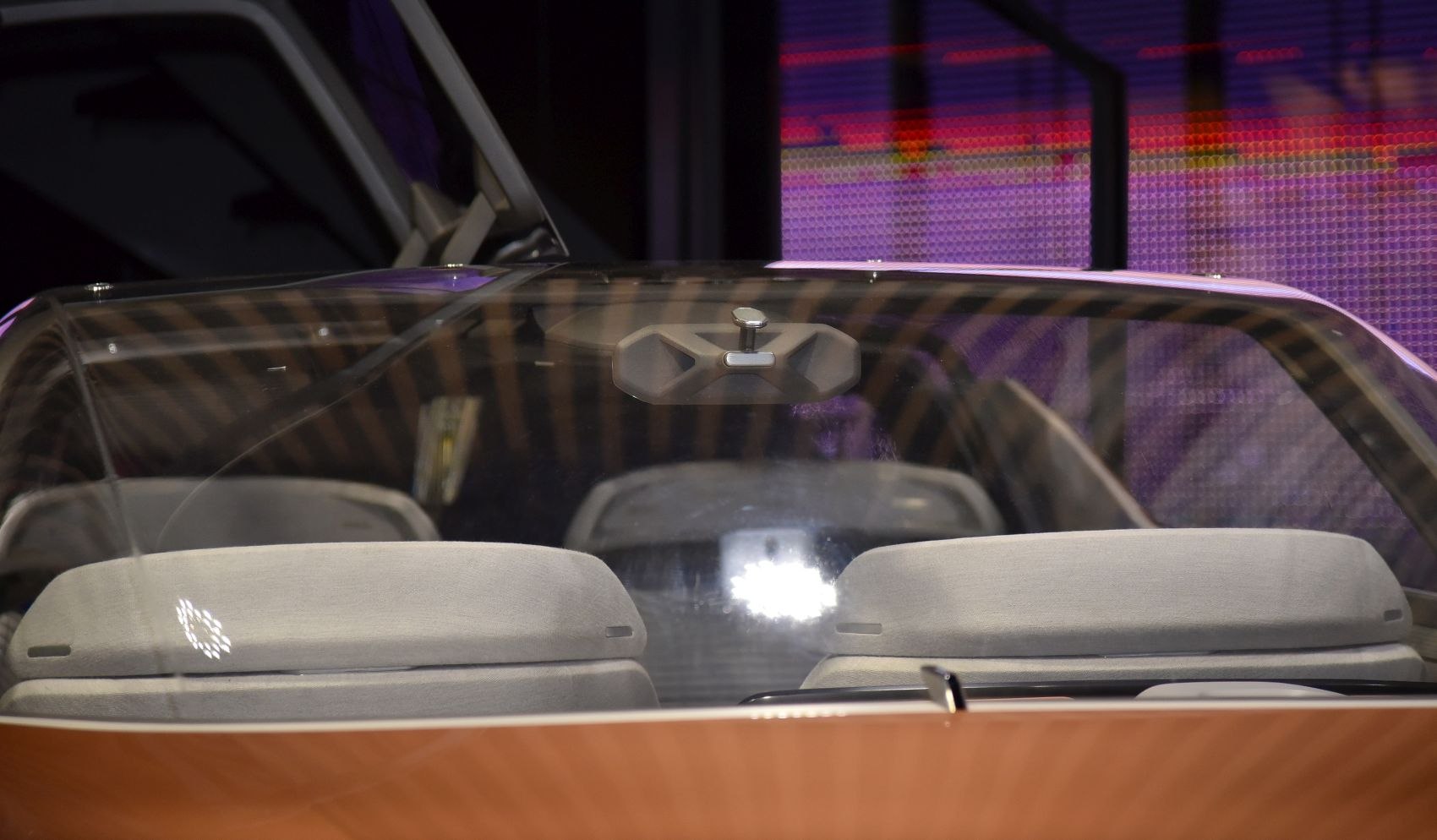 Front seats and dashboard seen through windshield