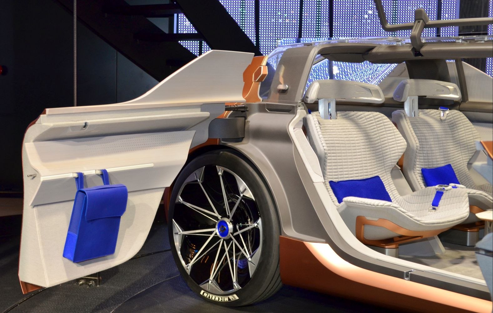 Futuristic car interior with advanced seats and unique wheel design