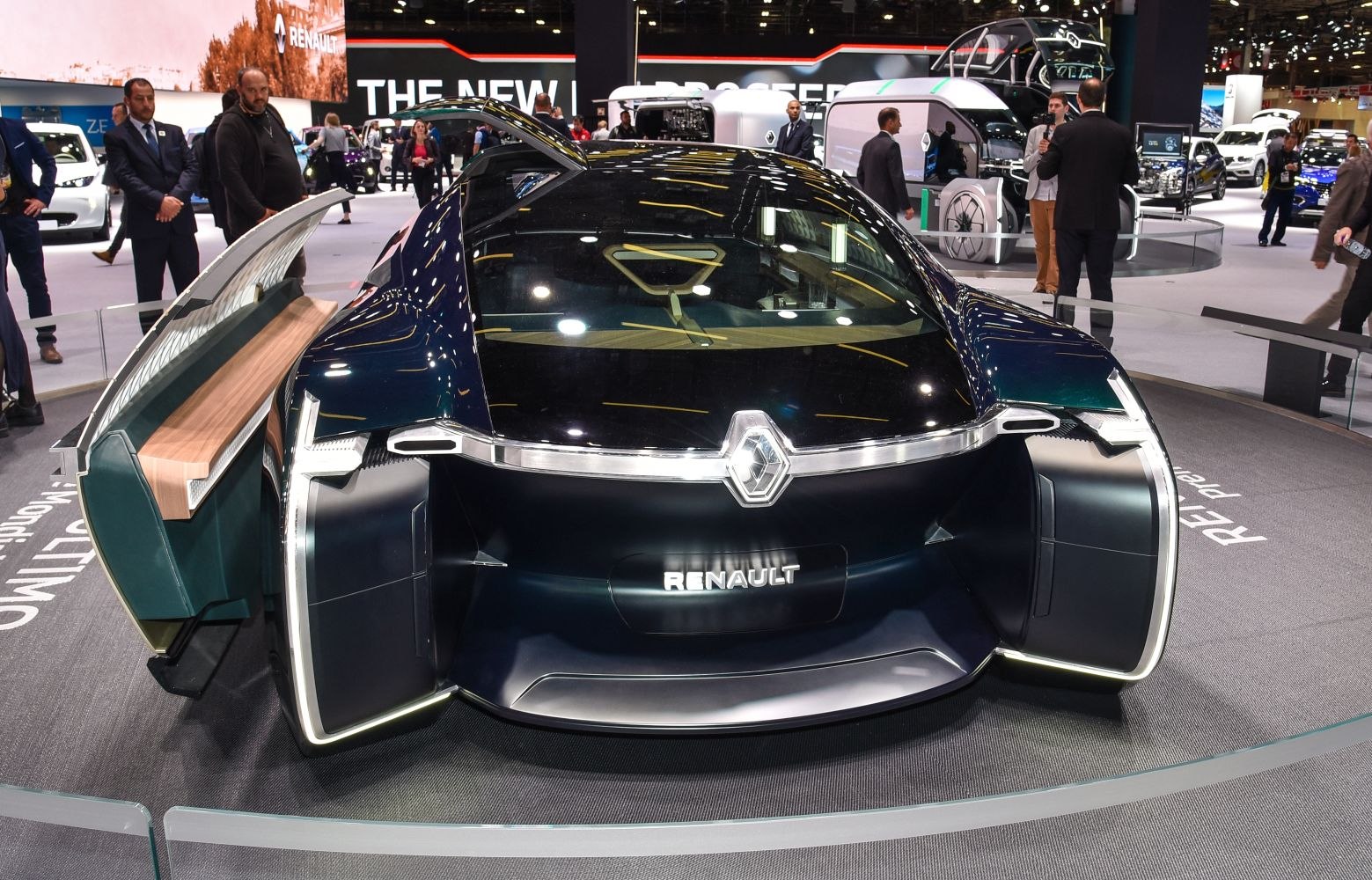Futuristic electric luxury sedan with unique door design and sleek exterior.