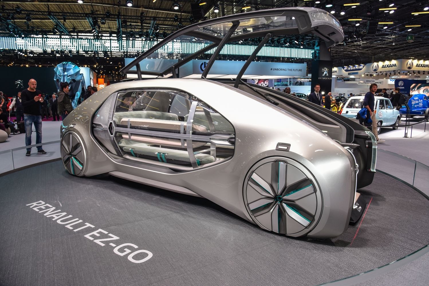 Futuristic autonomous shuttle with sliding glass doors and aerodynamic wheels