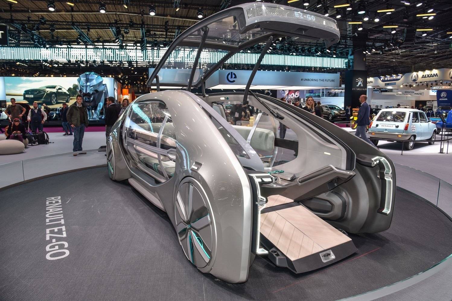 Futuristic concept vehicle with transparent doors and rear entry hatch