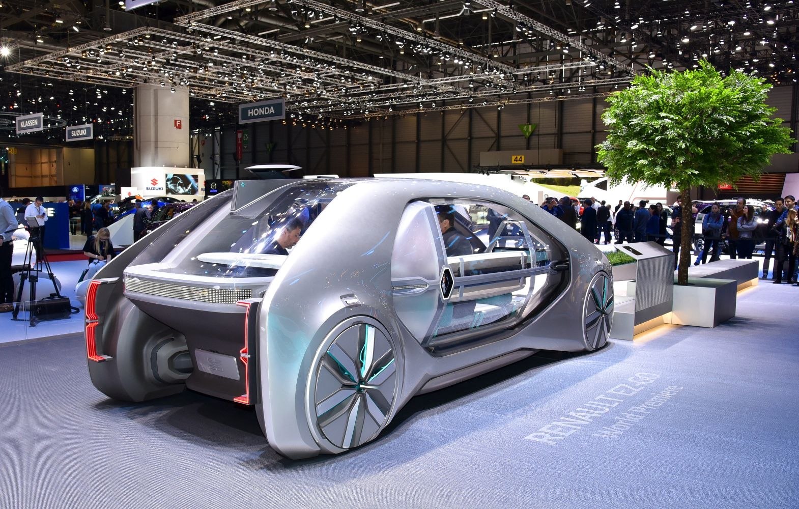 Futuristic autonomous vehicle with transparent doors and aerodynamic design