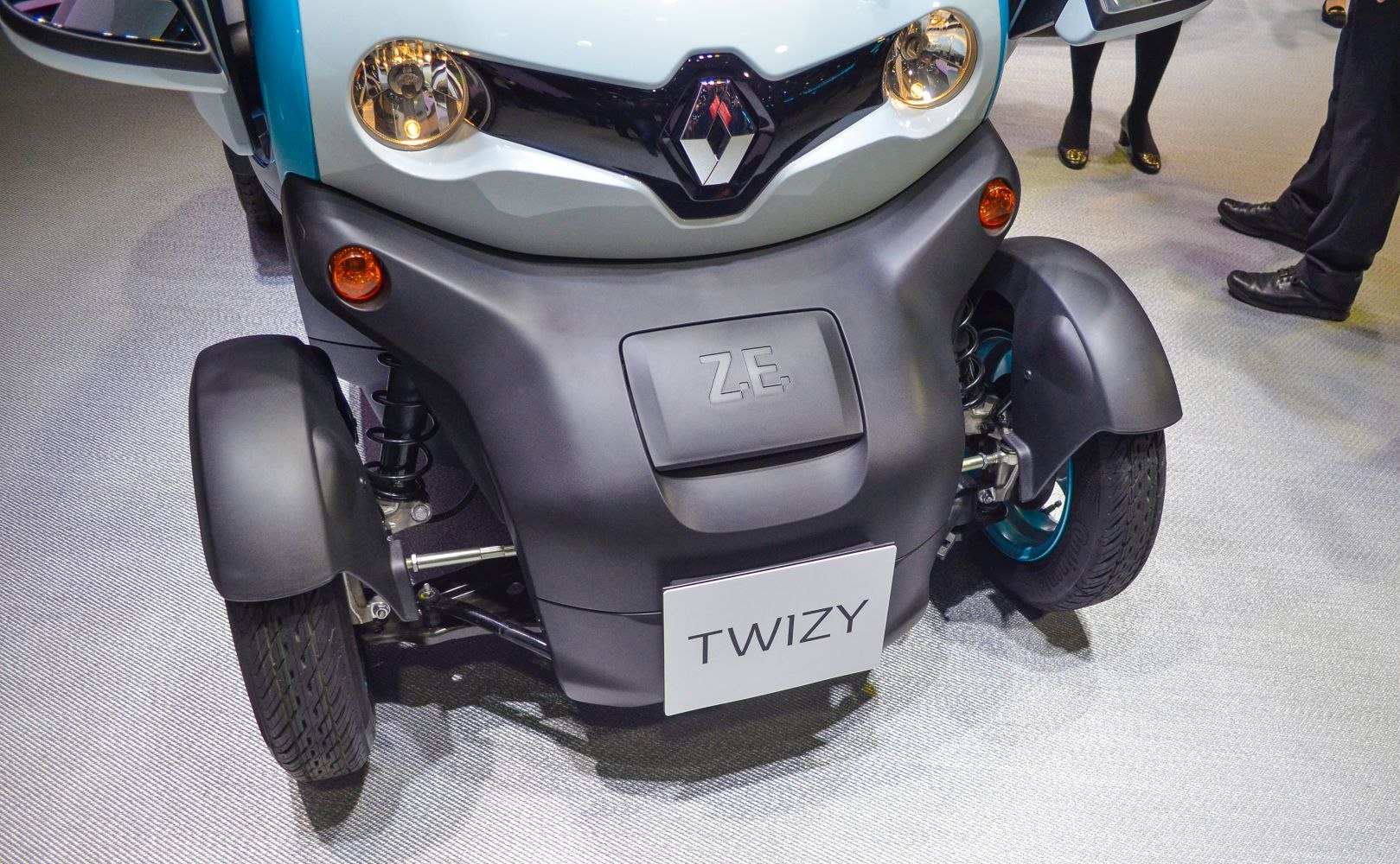Front close-up with headlights, ZE badge, and front wheel fenders