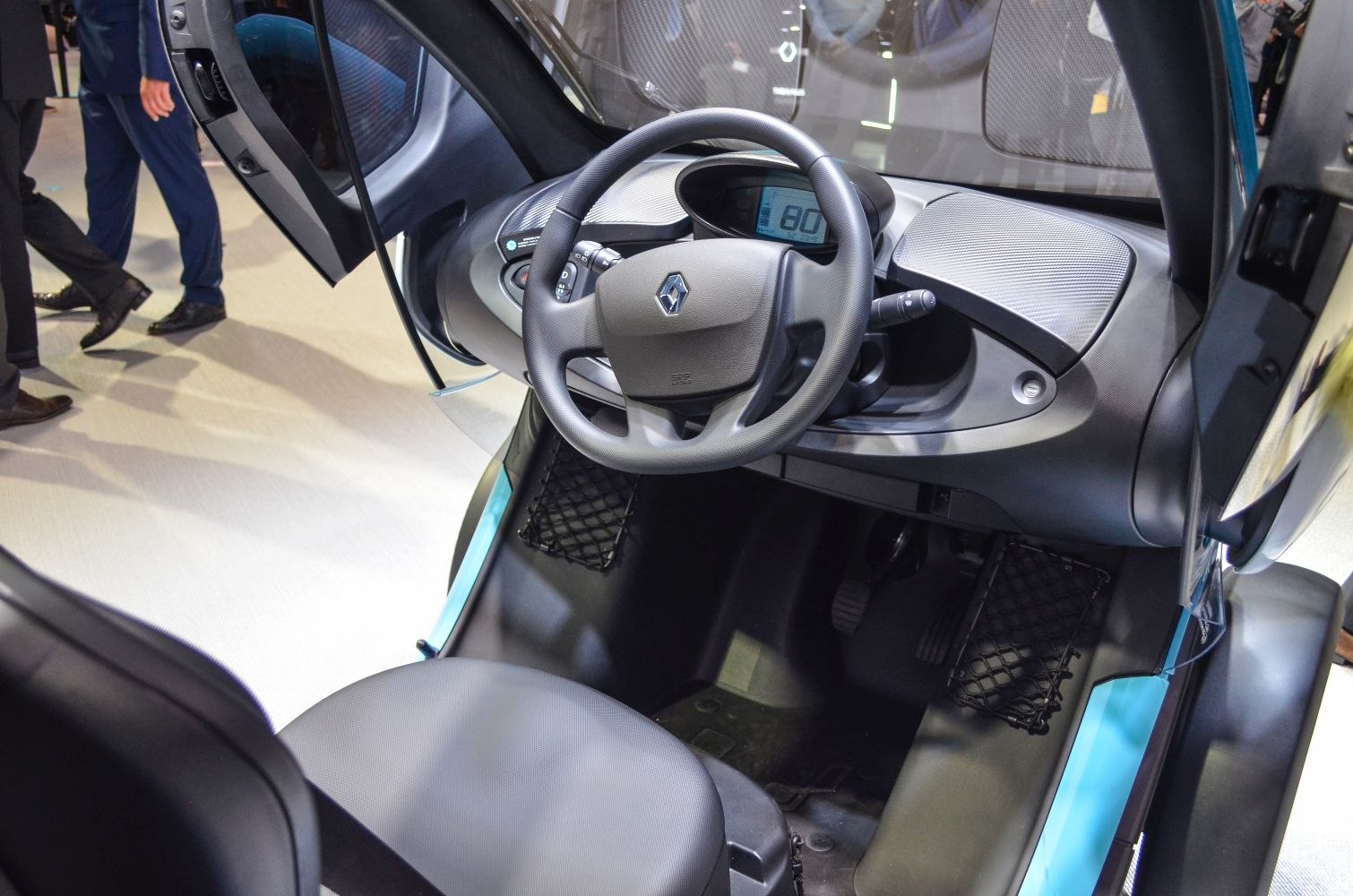 Compact steering wheel and digital dashboard inside electric vehicle