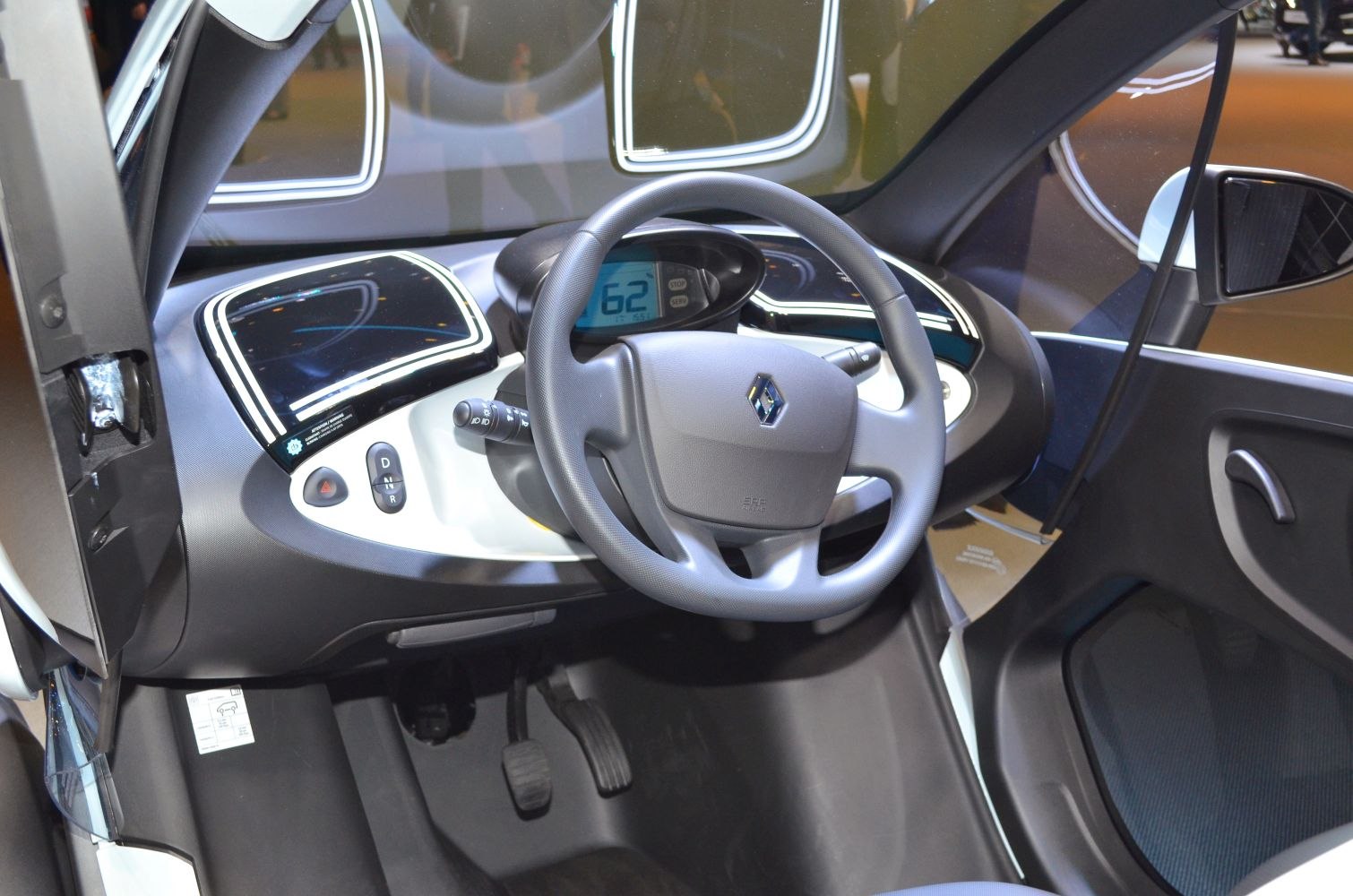 Dashboard with digital speedometer and steering wheel of a compact electric vehicle