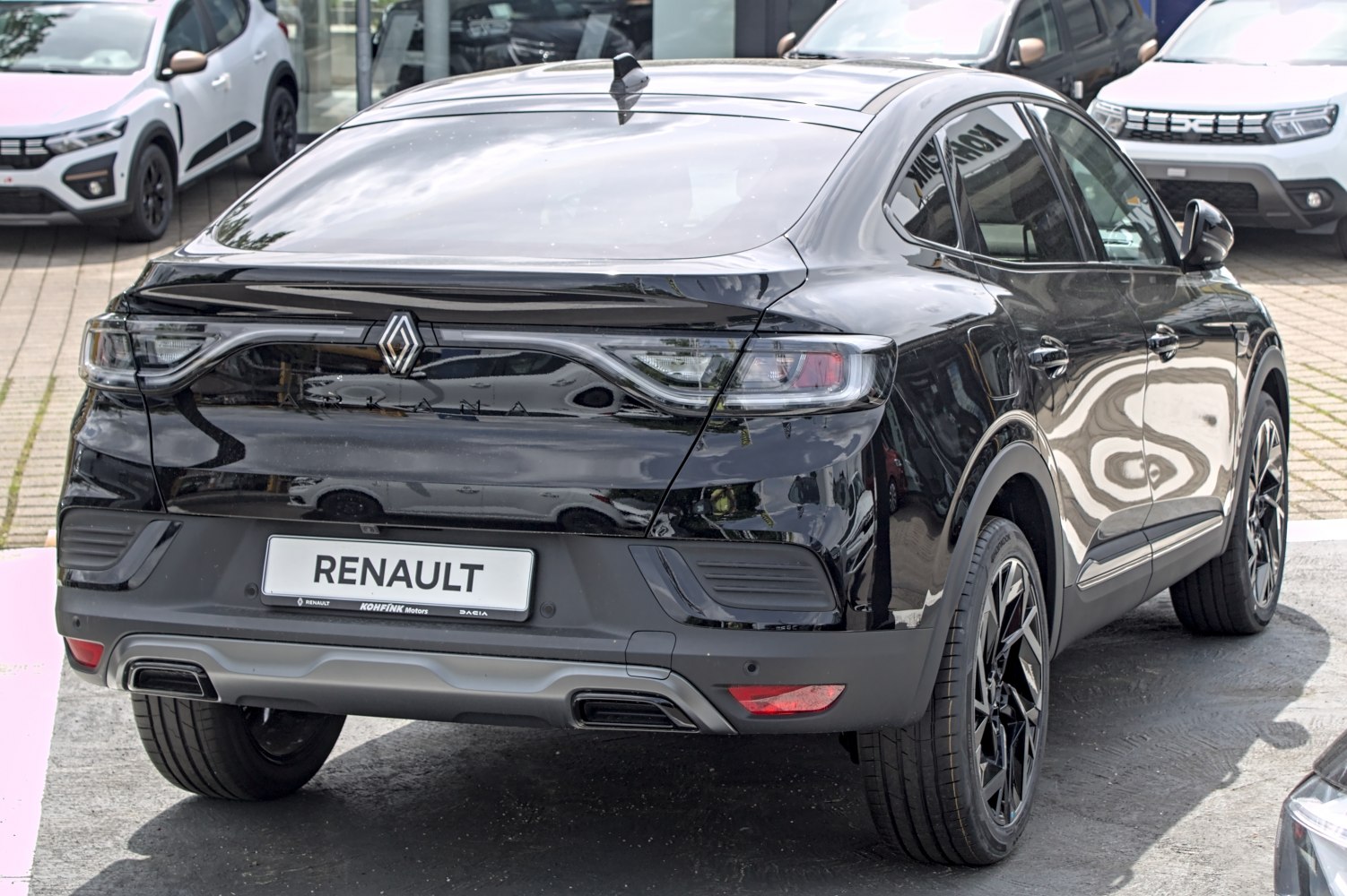 Sleek rear end with modern tail lights and dual exhausts