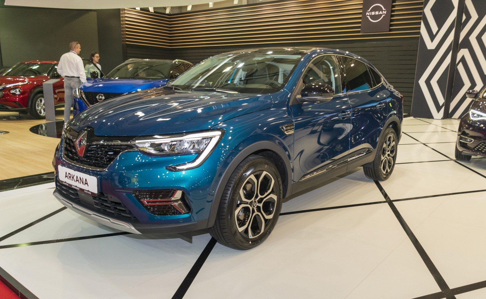 Front and side view of blue SUV with alloy wheels and LED headlights