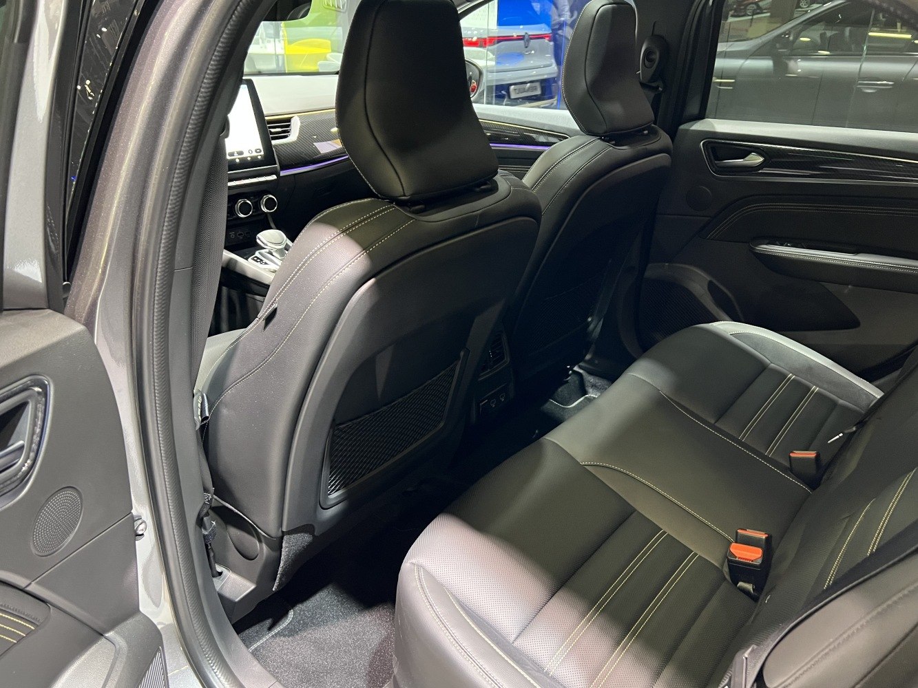 Spacious rear seating with leather upholstery and modern cabin details