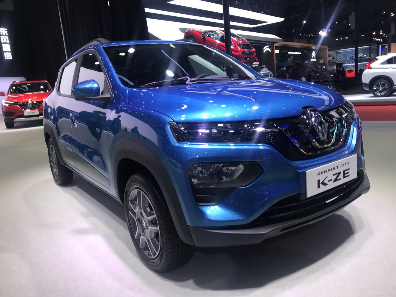 Front and side view of electric compact SUV with LED headlights