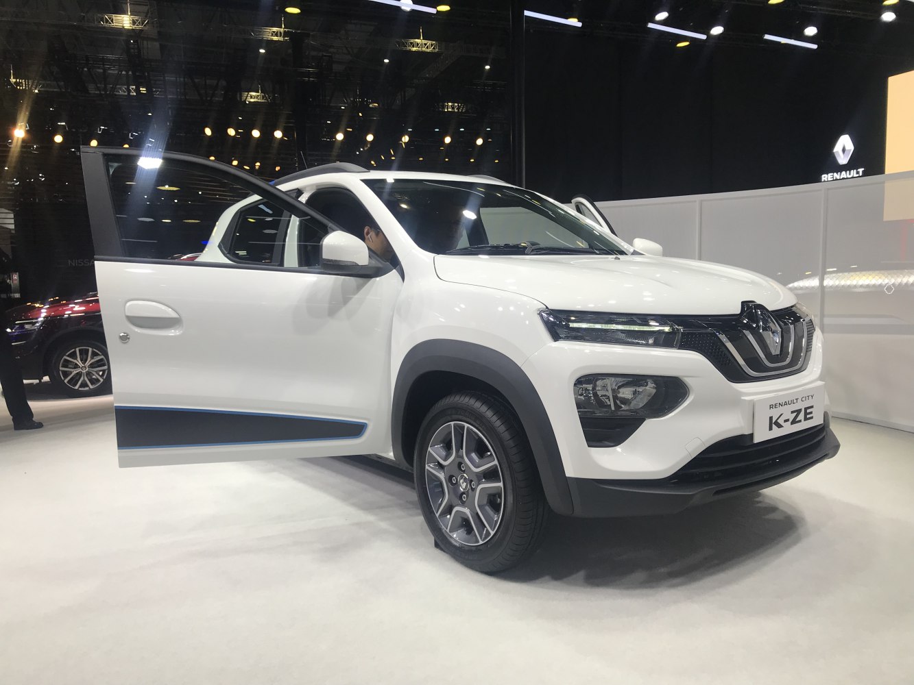 Front side view of a compact electric SUV with open driver door