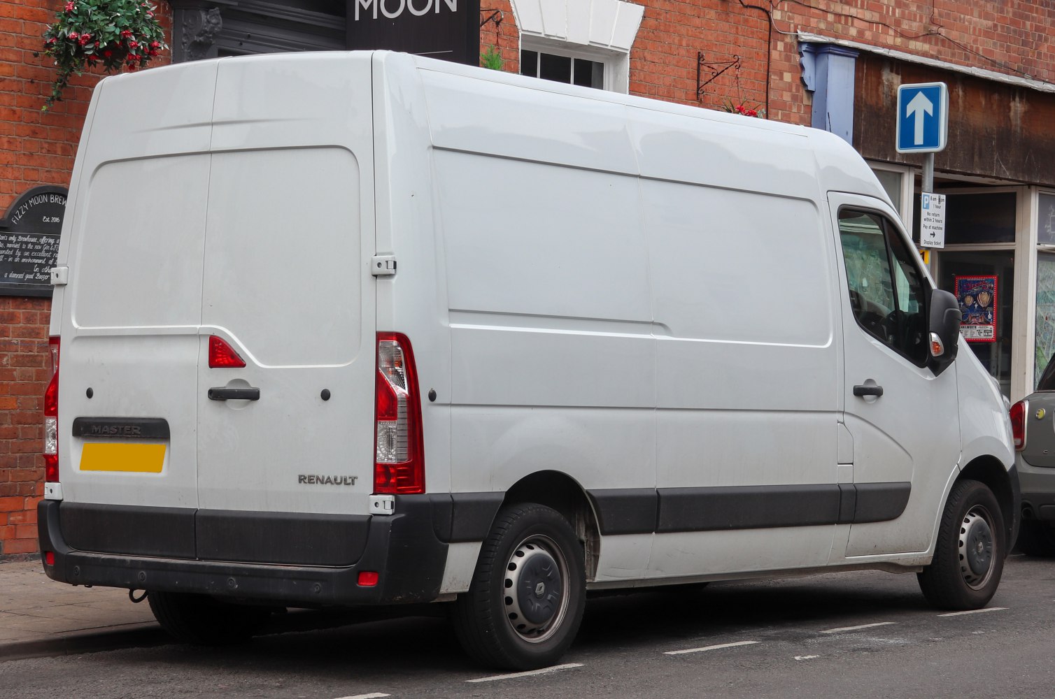 Rear and side view of a tall-roof white commercial panel van