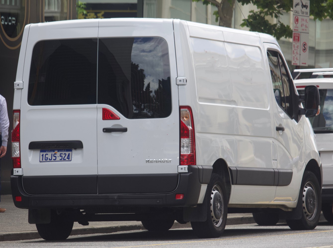 Split rear doors and side panel of white panel van