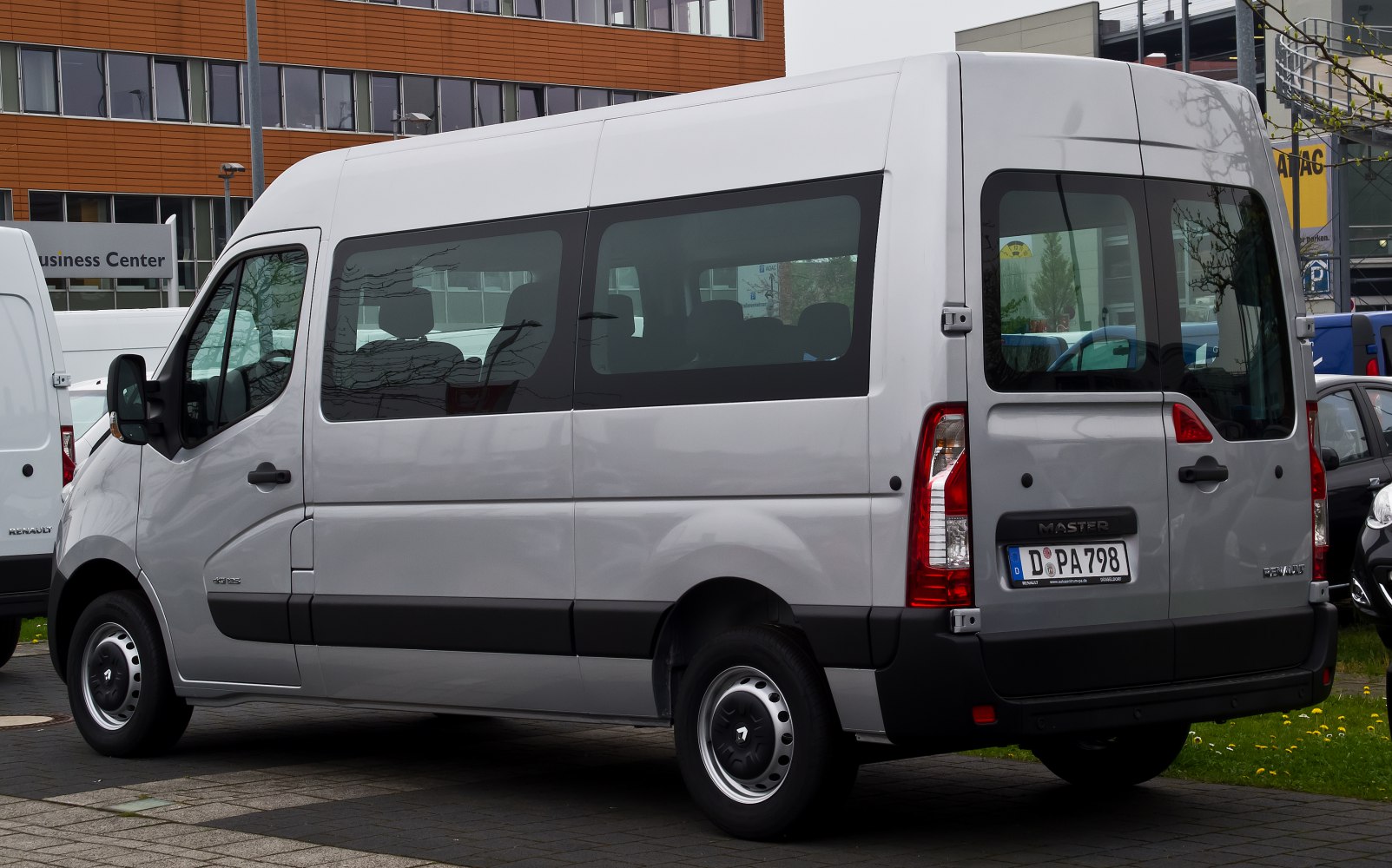 Silver combi van rear and side windows with vertical taillights