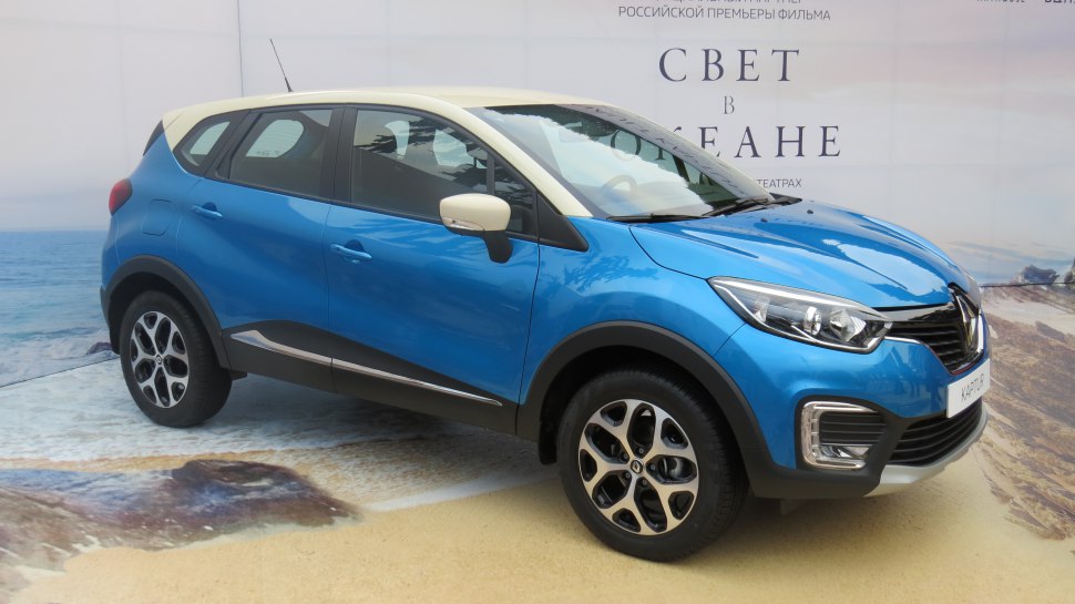 Blue compact SUV with two-tone roof and alloy wheels
