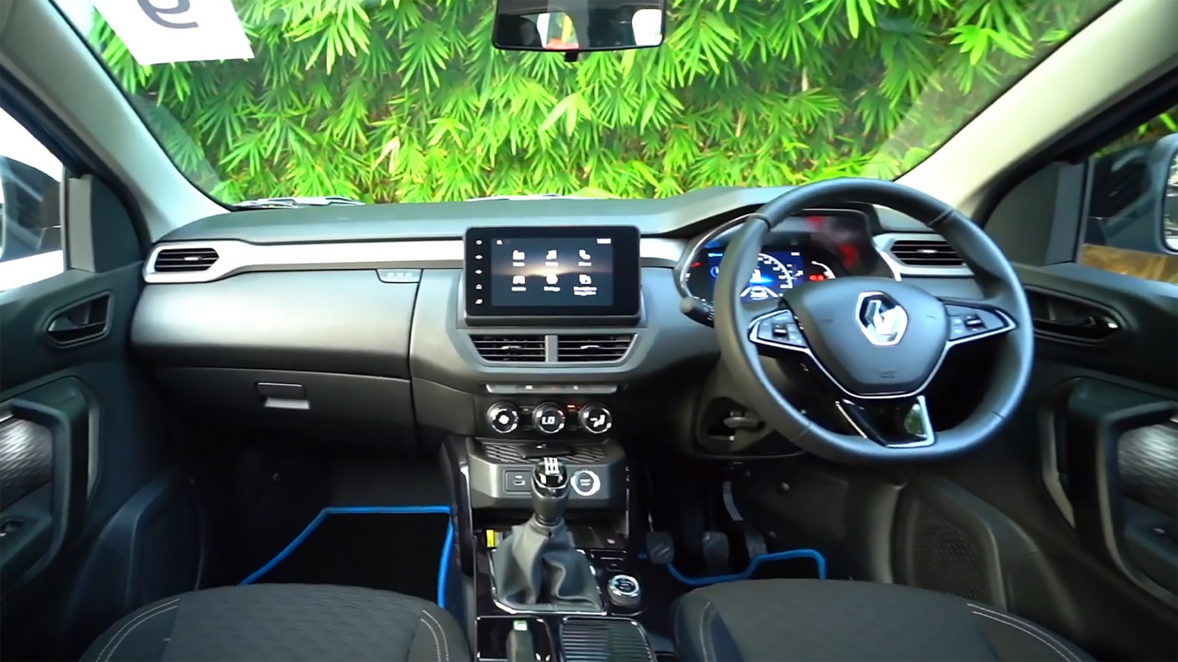 Interior dashboard with touchscreen and steering wheel controls
