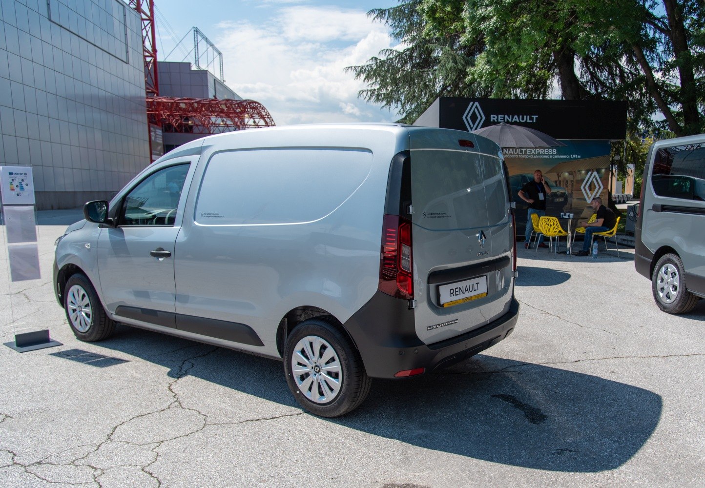 Rear and side view of compact cargo van with clean streamlined design and practical rear doors.