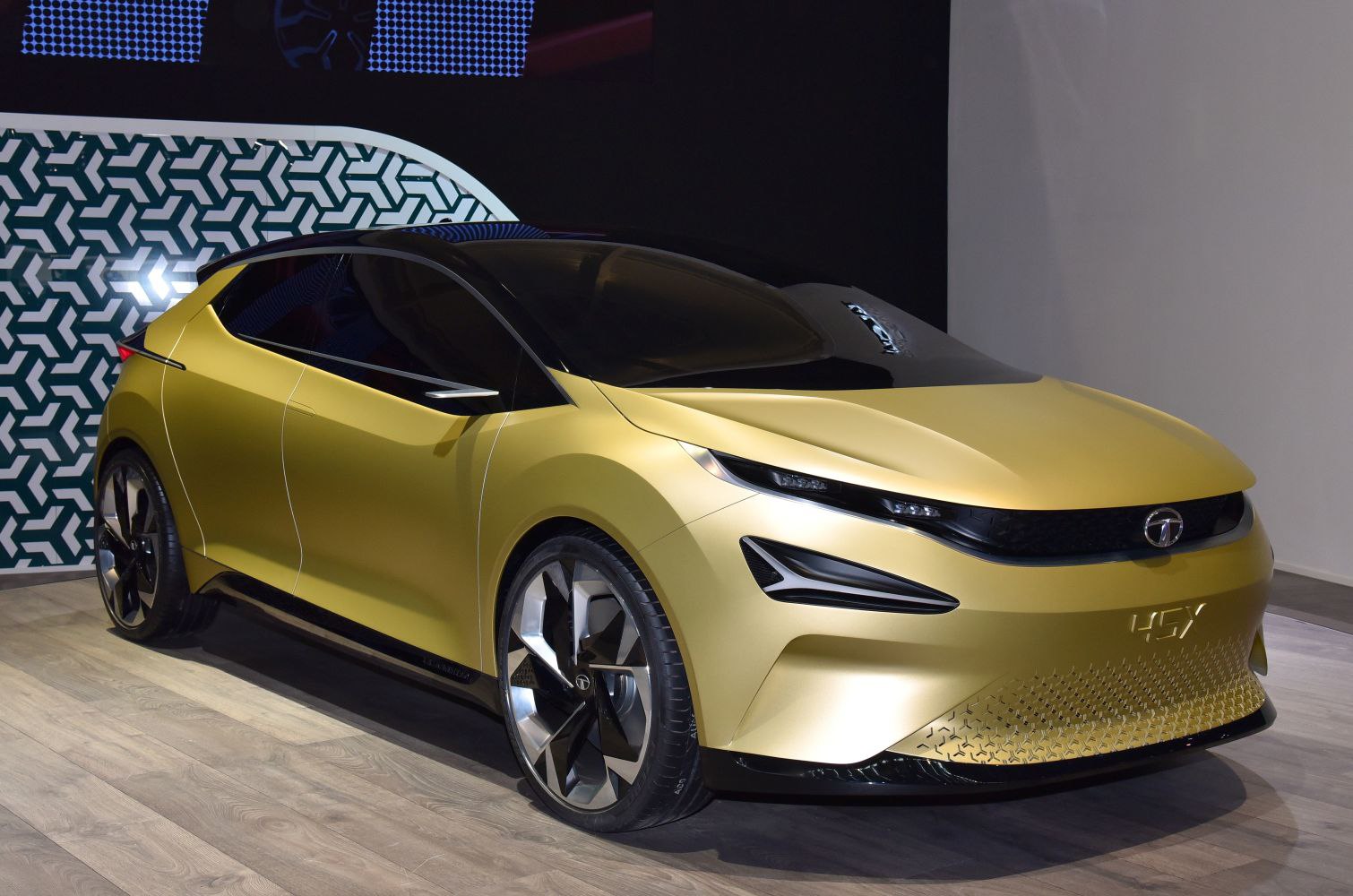 Sleek aerodynamic front with sharp LED lights and geometric grille pattern