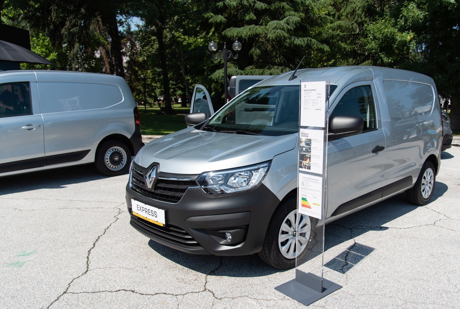 Front exterior and design of a silver mid-size commercial panel van