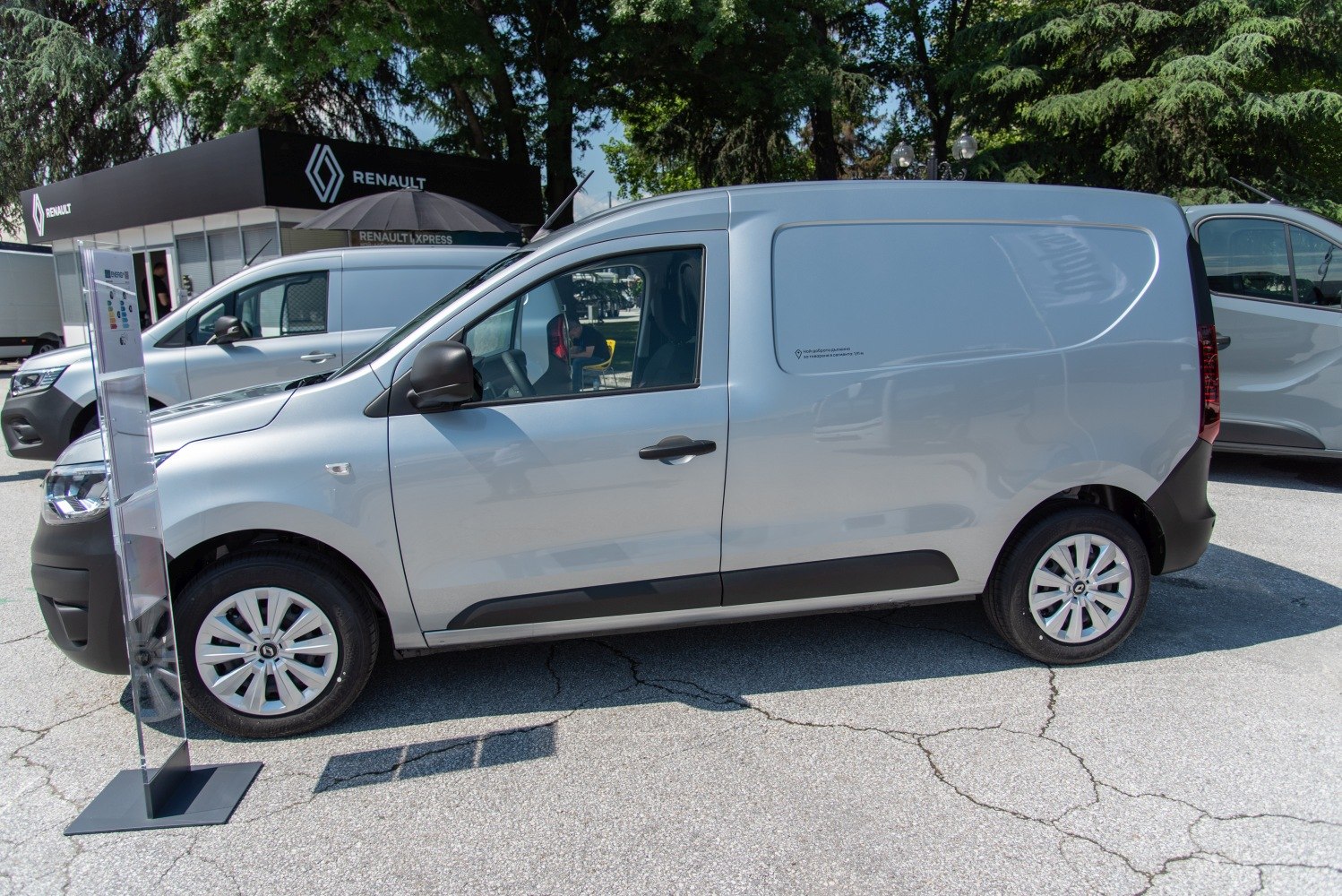 Side profile of silver compact cargo van with sliding door
