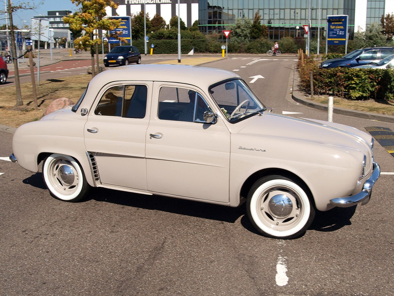 Vintage rounded sedan with whitewall tires and classic 1950s styling