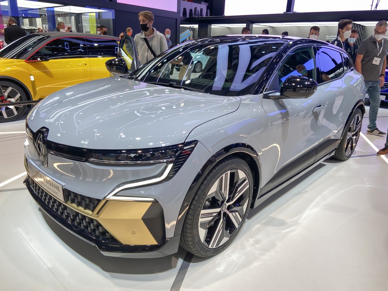 Front view showing sleek LED headlights and grille with black and gold accents.