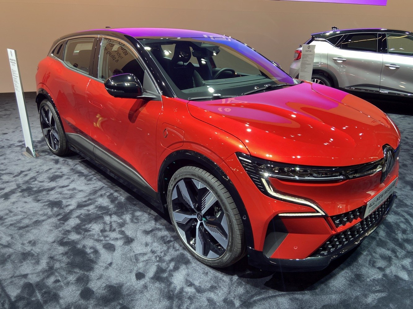 Front-side view of electric car with LED lights and sporty wheels