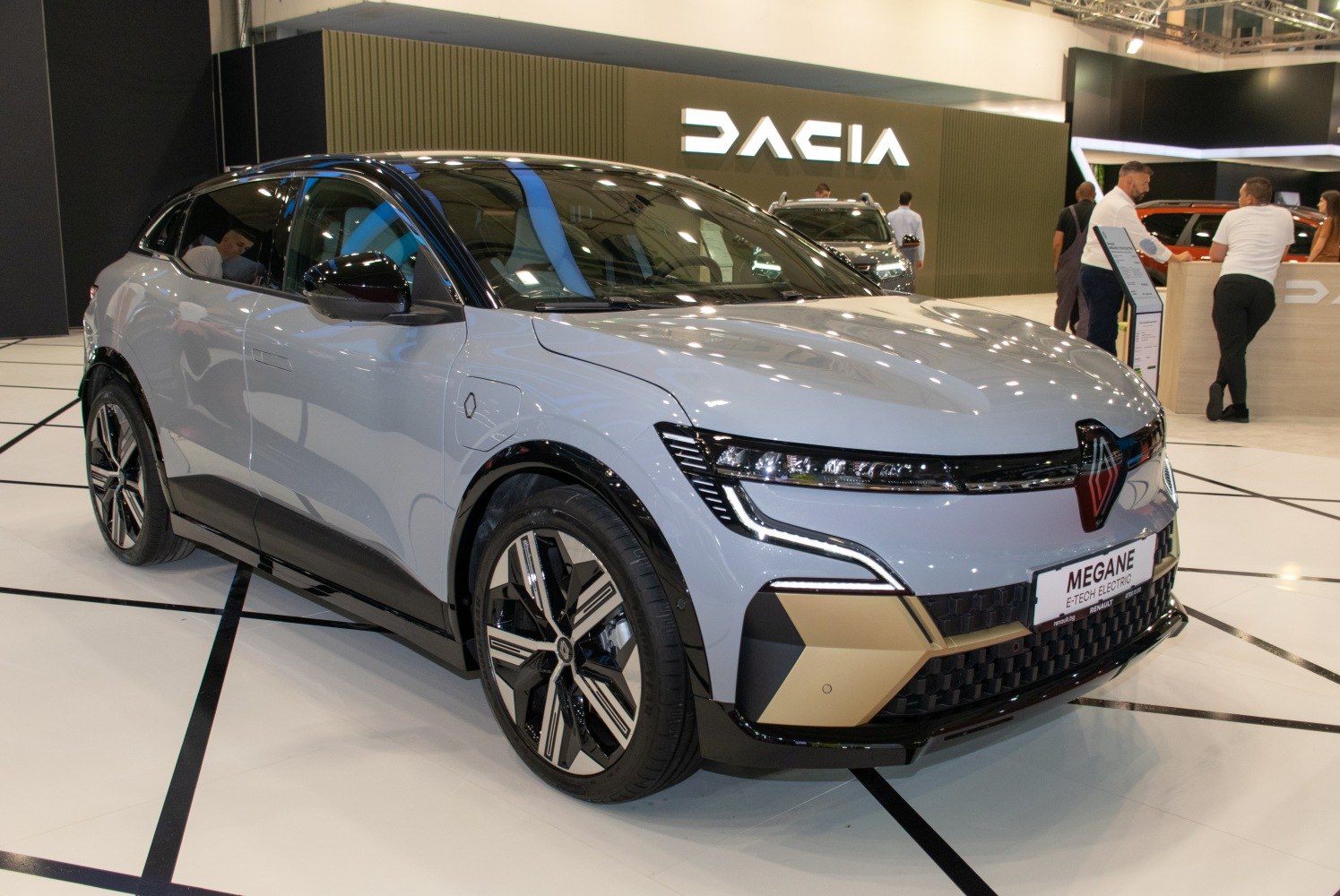 Front side angle view of a modern electric vehicle with LED headlights and unique wheel design