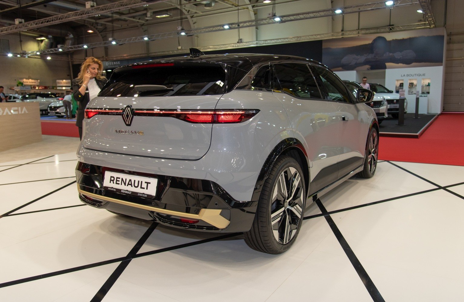 Rear view with sleek tail lights and alloy wheels